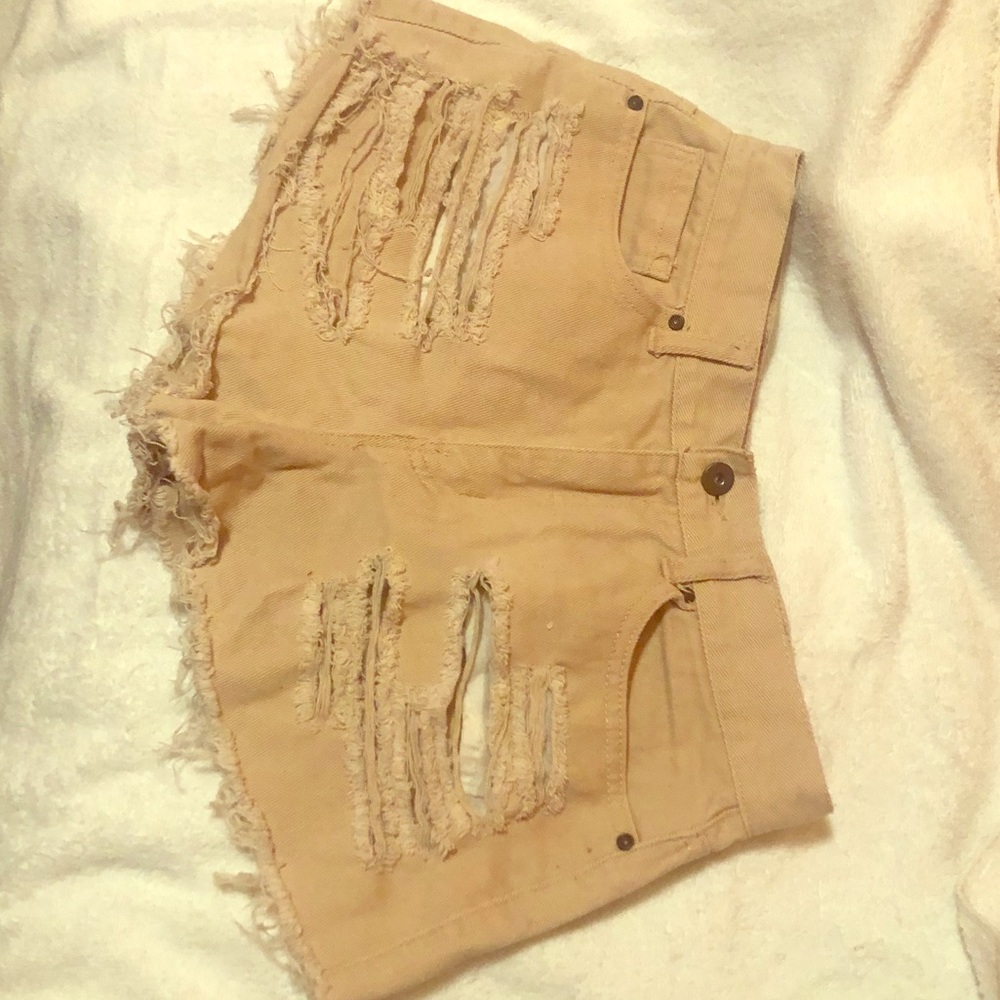 Distressed pink denim shorts